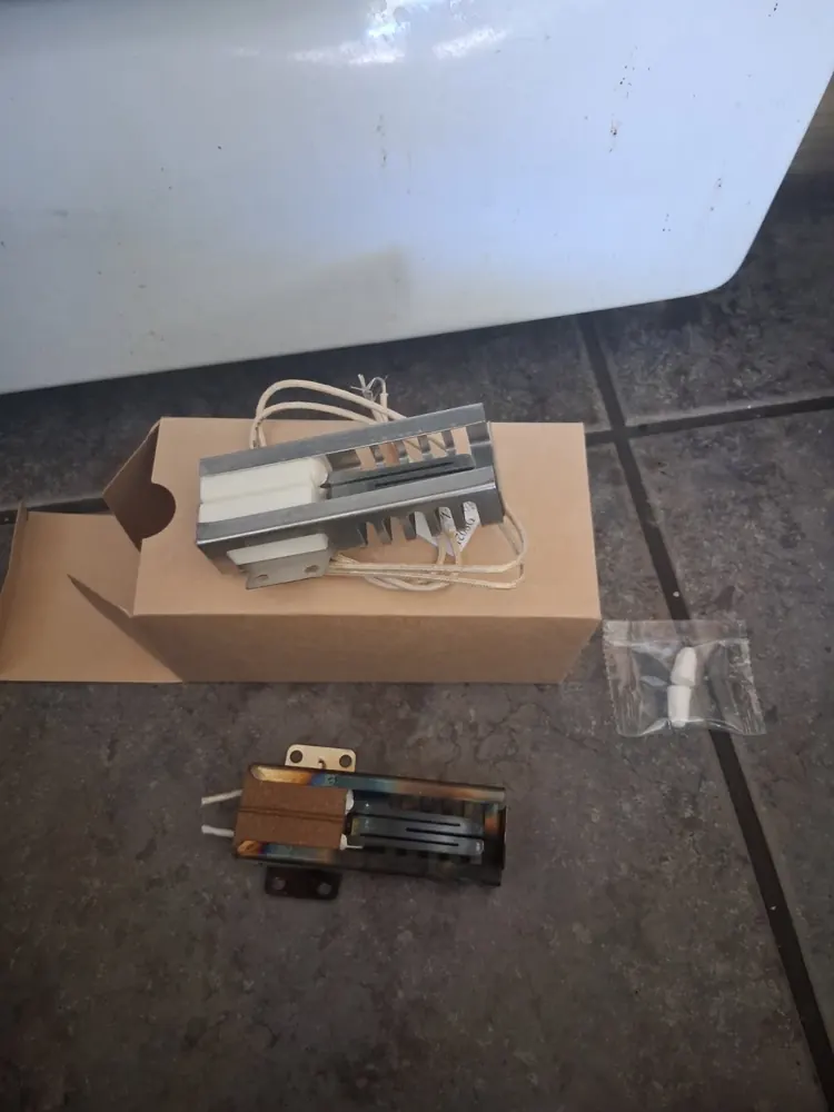 New gas oven igniter next to the failed igniter removed from a range in Las Vegas