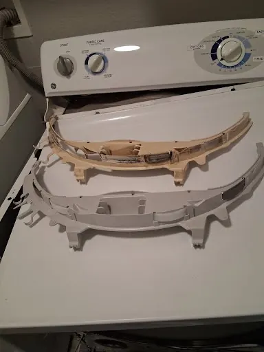 GE top-load washer console and lid removed for repair