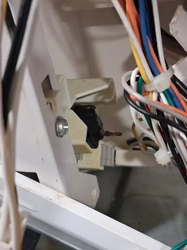 Lid lock switch and wiring inside a top-load washer